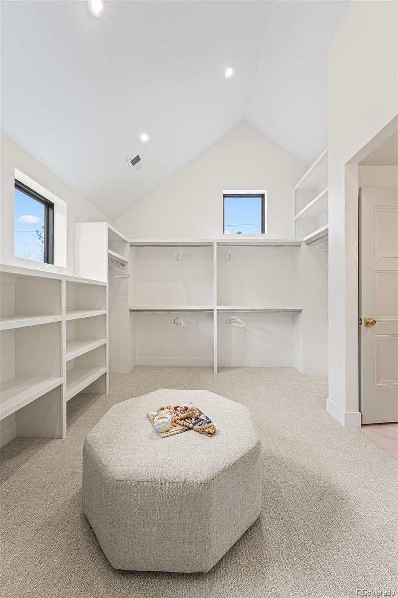 354 Cherry Street Denver, CO 80220 - Photo 31 of 44 a view of a bedroom with a refrigerator and more cabinets
