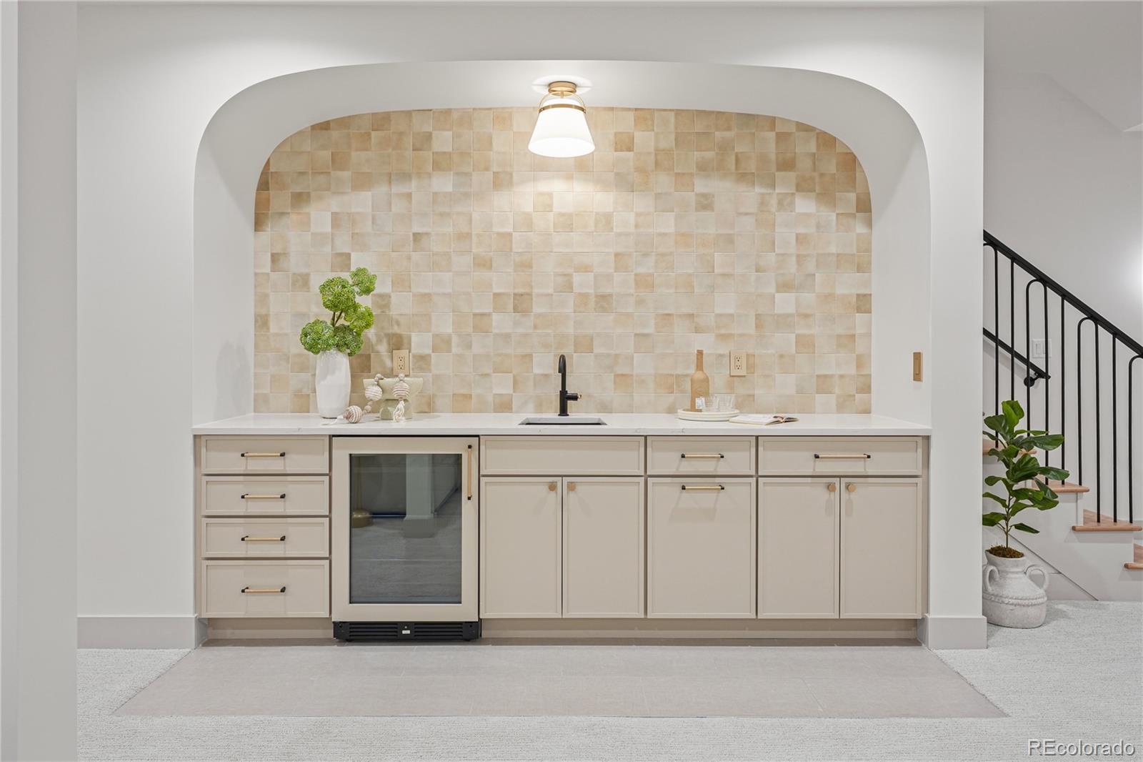 354 Cherry Street Denver, CO 80220 - Photo 34 of 44 a view of cabinets a sink and a window in a room