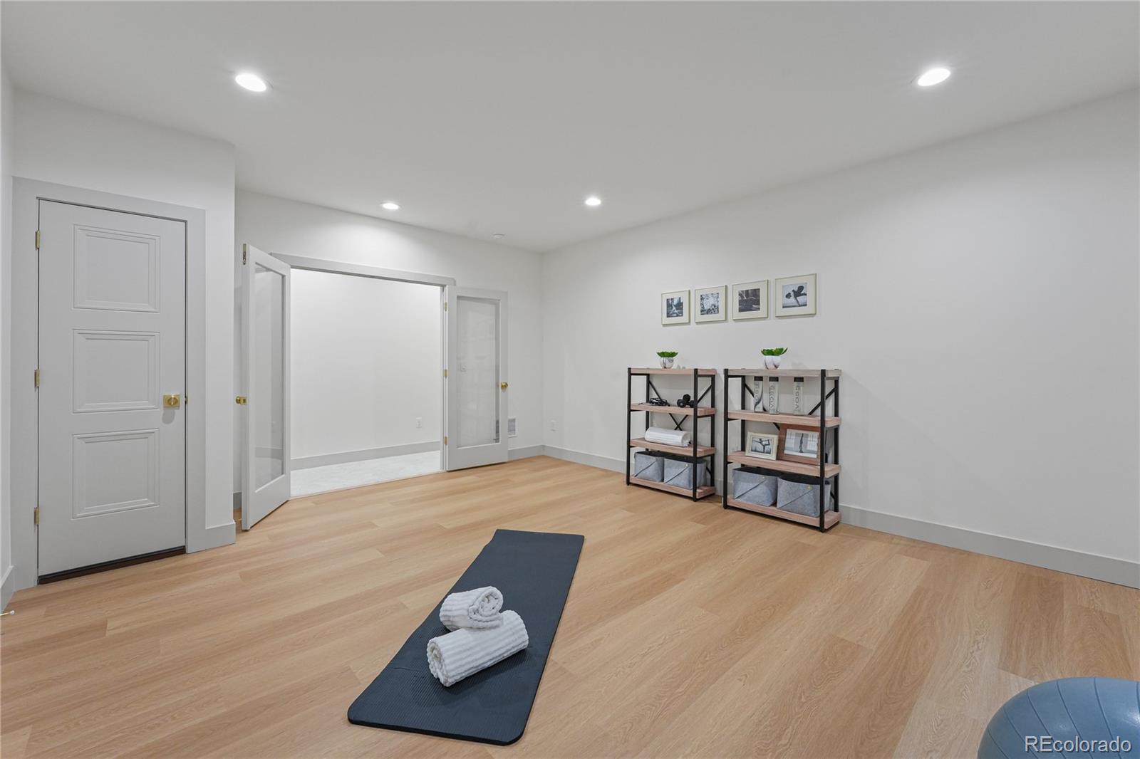 354 Cherry Street Denver, CO 80220 - Photo 35 of 44 a view of a room with furniture and wooden floor
