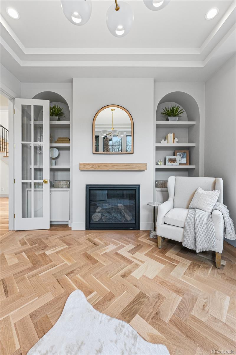 354 Cherry Street Denver, CO 80220 - Photo 6 of 44 a living room with furniture and a fireplace