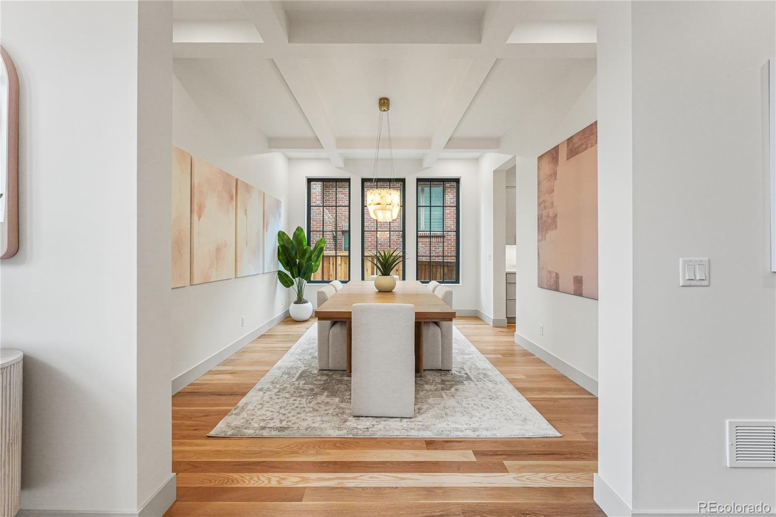 354 Cherry Street Denver, CO 80220 - Photo 8 of 44 a view of a dining room with furniture window and wooden floor