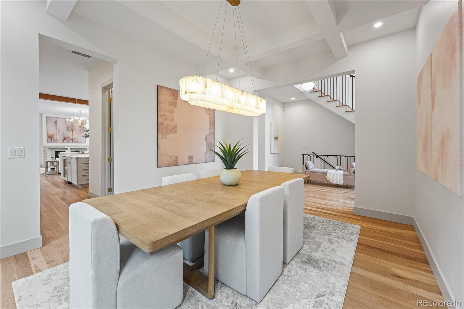 354 Cherry Street Denver, CO 80220 - Photo 9 of 44 a view of a kitchen area with furniture and wooden floor