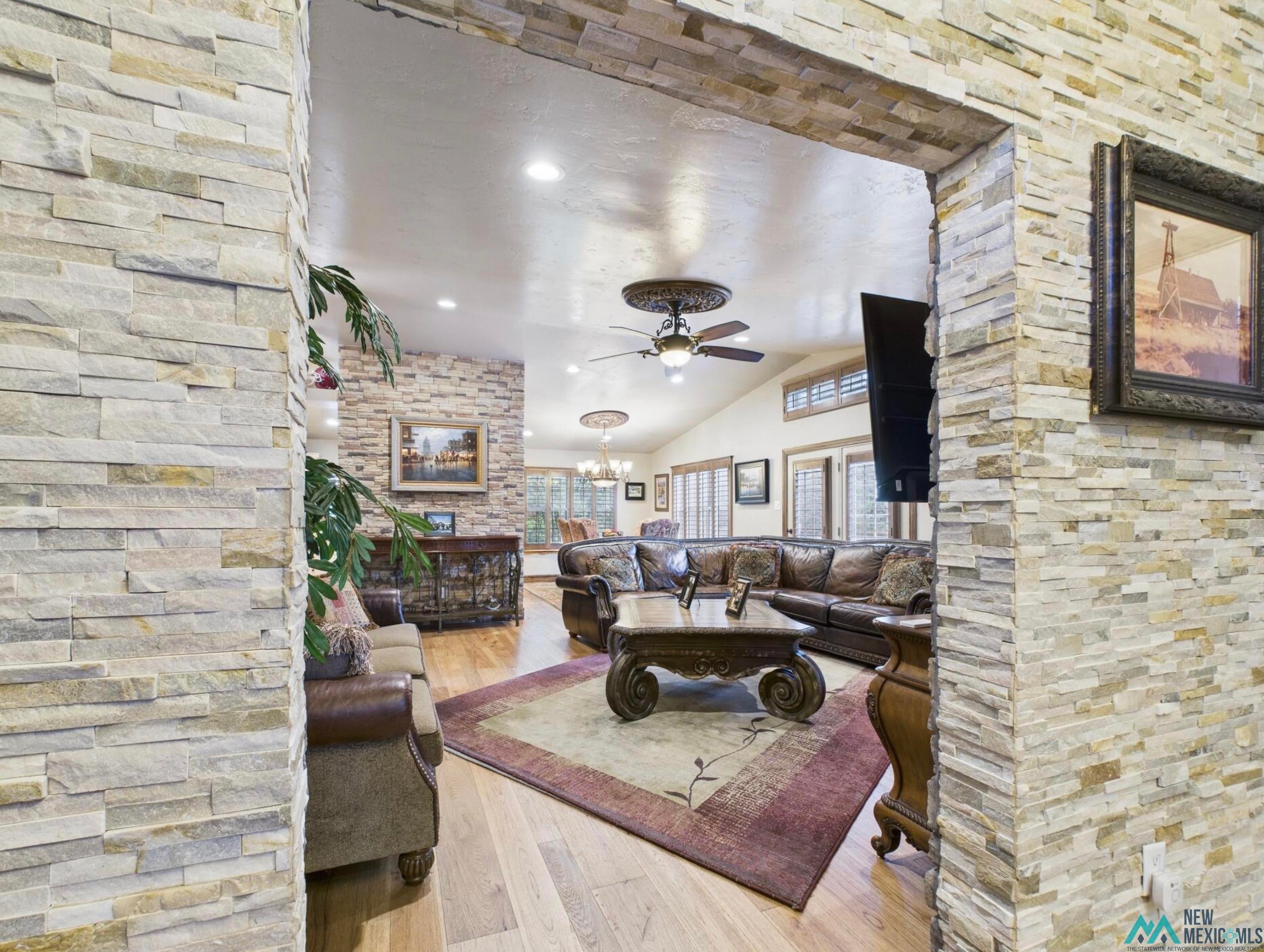 103 Granite Drive Ruidoso, NM 88345 - Photo 4 of 28 Stone-clad entryway archway with recessed lighting