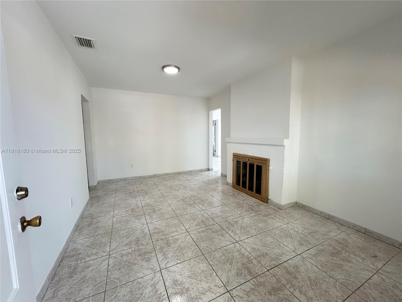 40 Northwest 39th Street, Unit 40 Miami, FL 33127 - Photo 4 of 17 a view of a livingroom with a fireplace