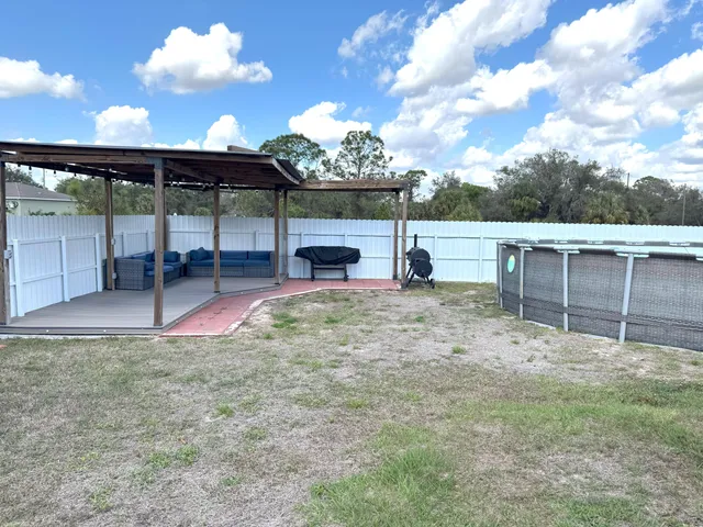 a view of a backyard with porch