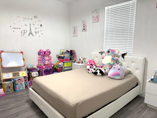 a bedroom with a bed and a table