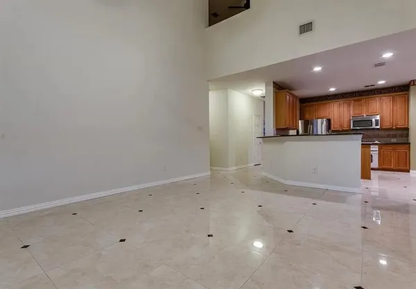 a view of kitchen with wooden floor and electronic appliances