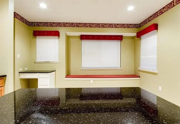 a bathroom with a bathtub and a window