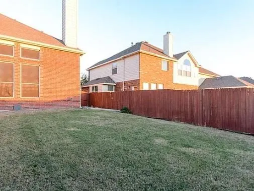 a backyard view with hardwood wall
