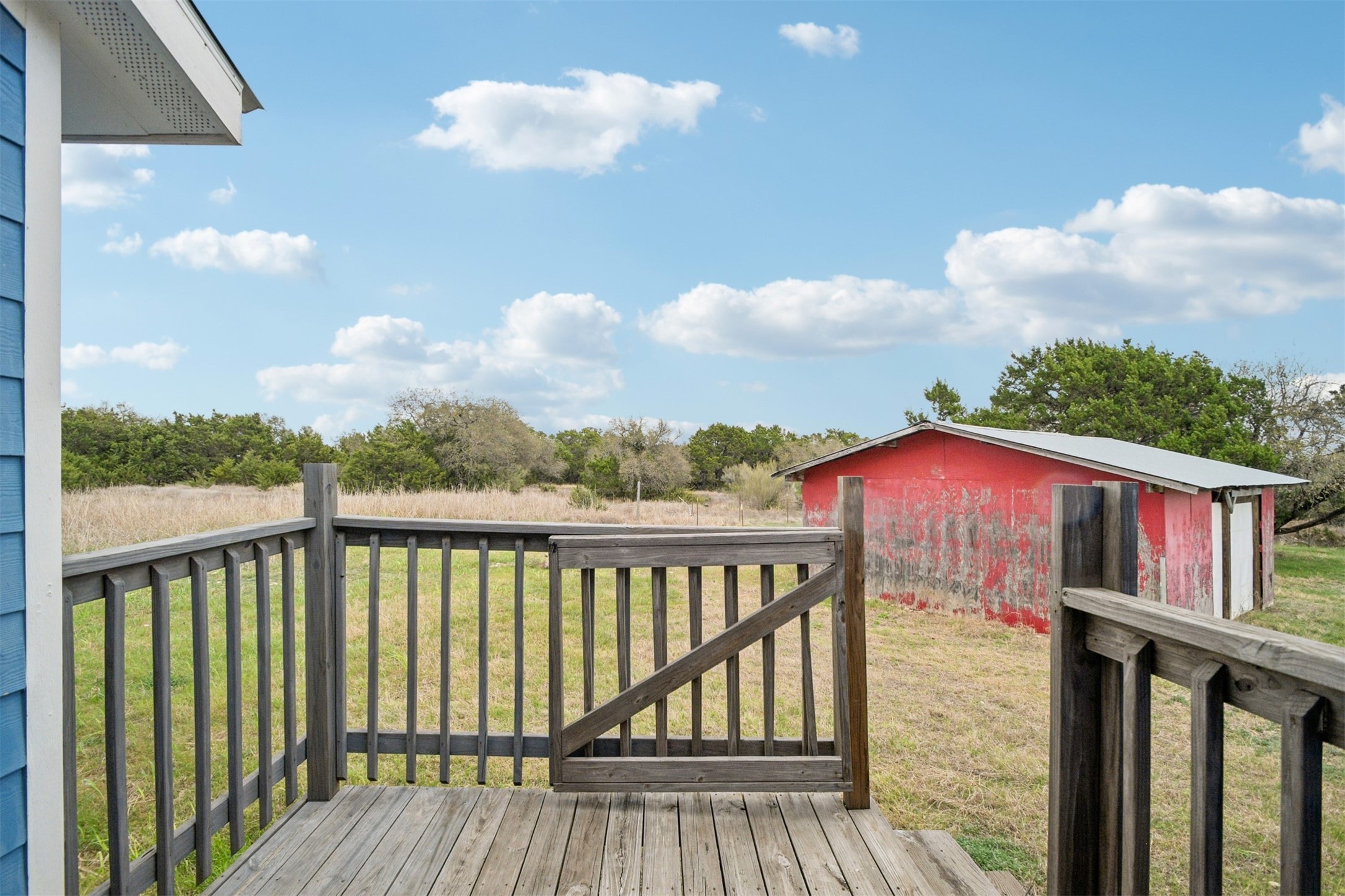 1470 Oak Grove Road Leander, TX 78641 - Photo 24 of 38 a view of a balcony with wooden floor