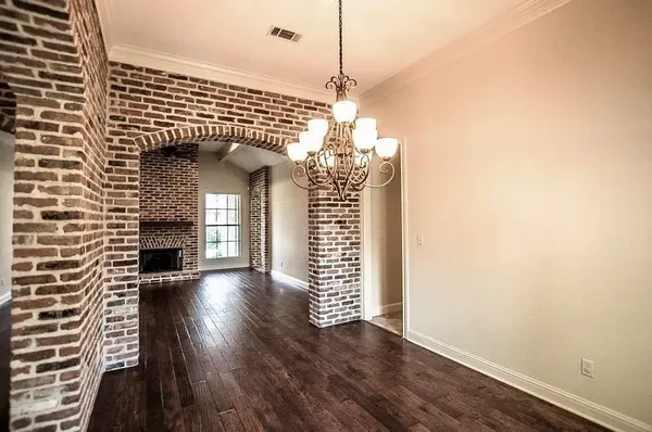 a view of a livingroom with wooden floor