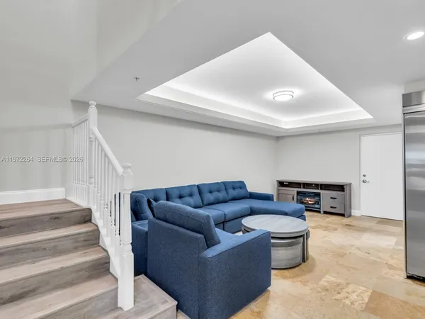 a large kitchen with granite countertop a sink stove and refrigerator