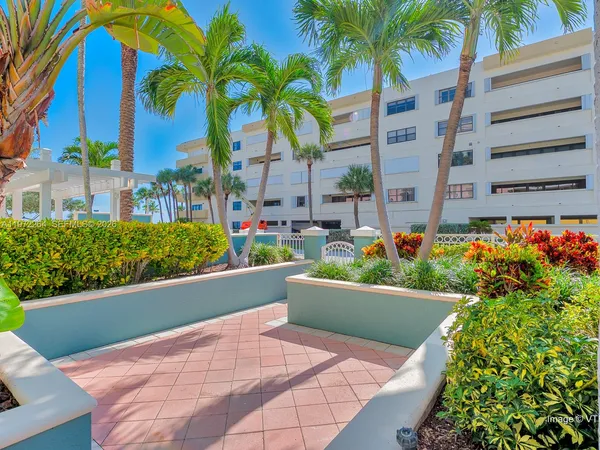 a view of a palm trees in front of a building