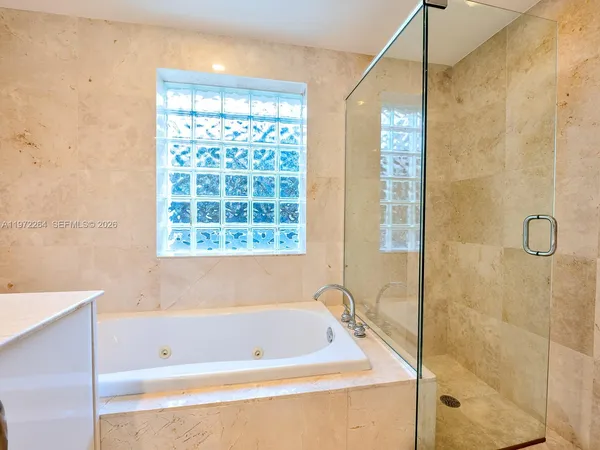 a view of room with closet and wooden floor