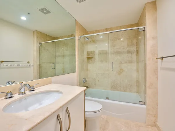 a view of a air conditioner and a floor to ceiling window