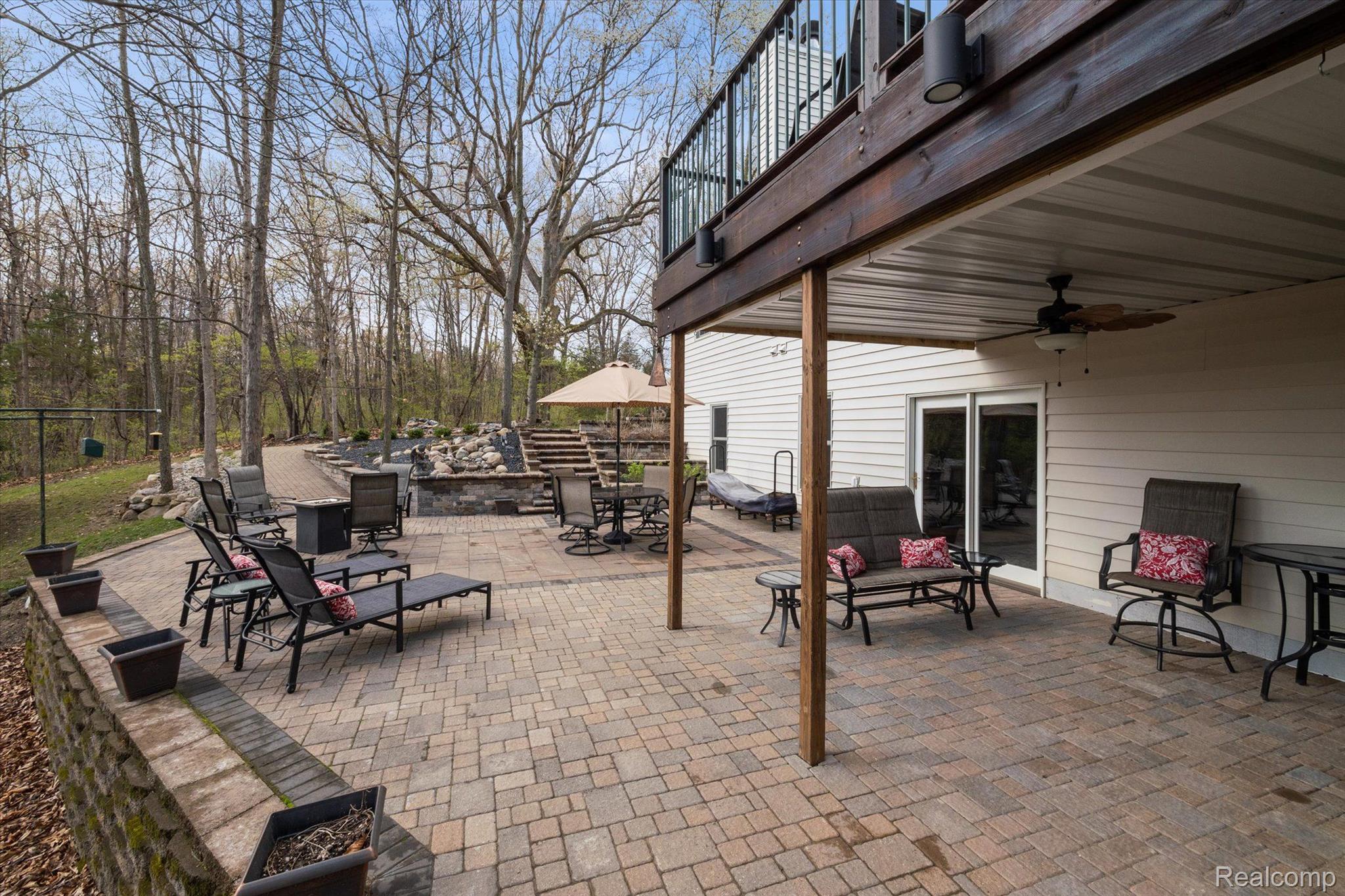 2659 West Coon Lake Road Howell, MI 48843 - Photo 35 of 45 Lower Level Patio w Covered Seating