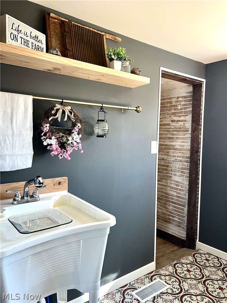 12972 Gilmore Road Southeast Port Washington, OH 43837 - Photo 18 of 50 Laundry room with baseboards