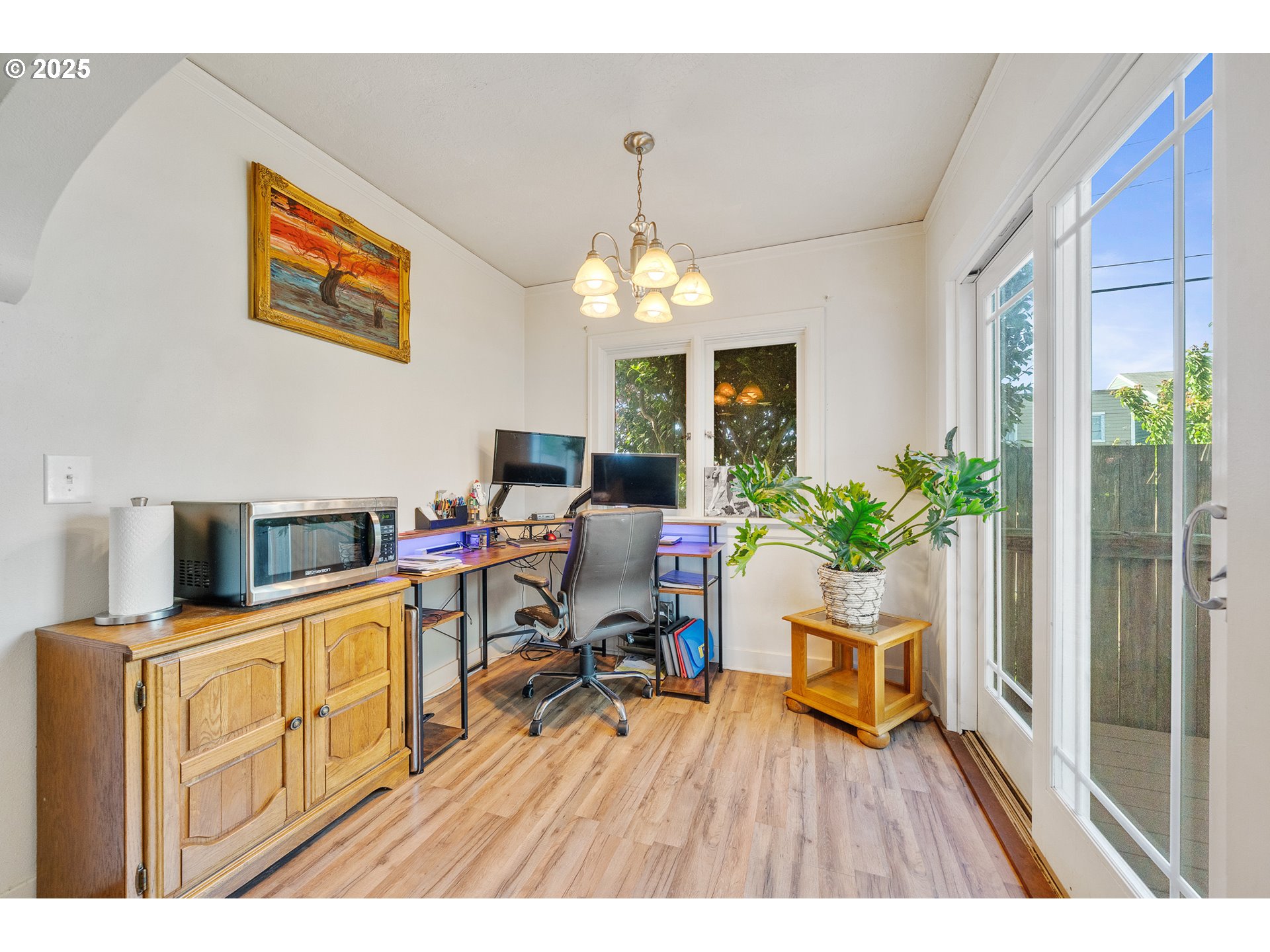 1703 4th Street Tillamook, OR 97141 - Photo 12 of 36 a living room with furniture and a chandelier