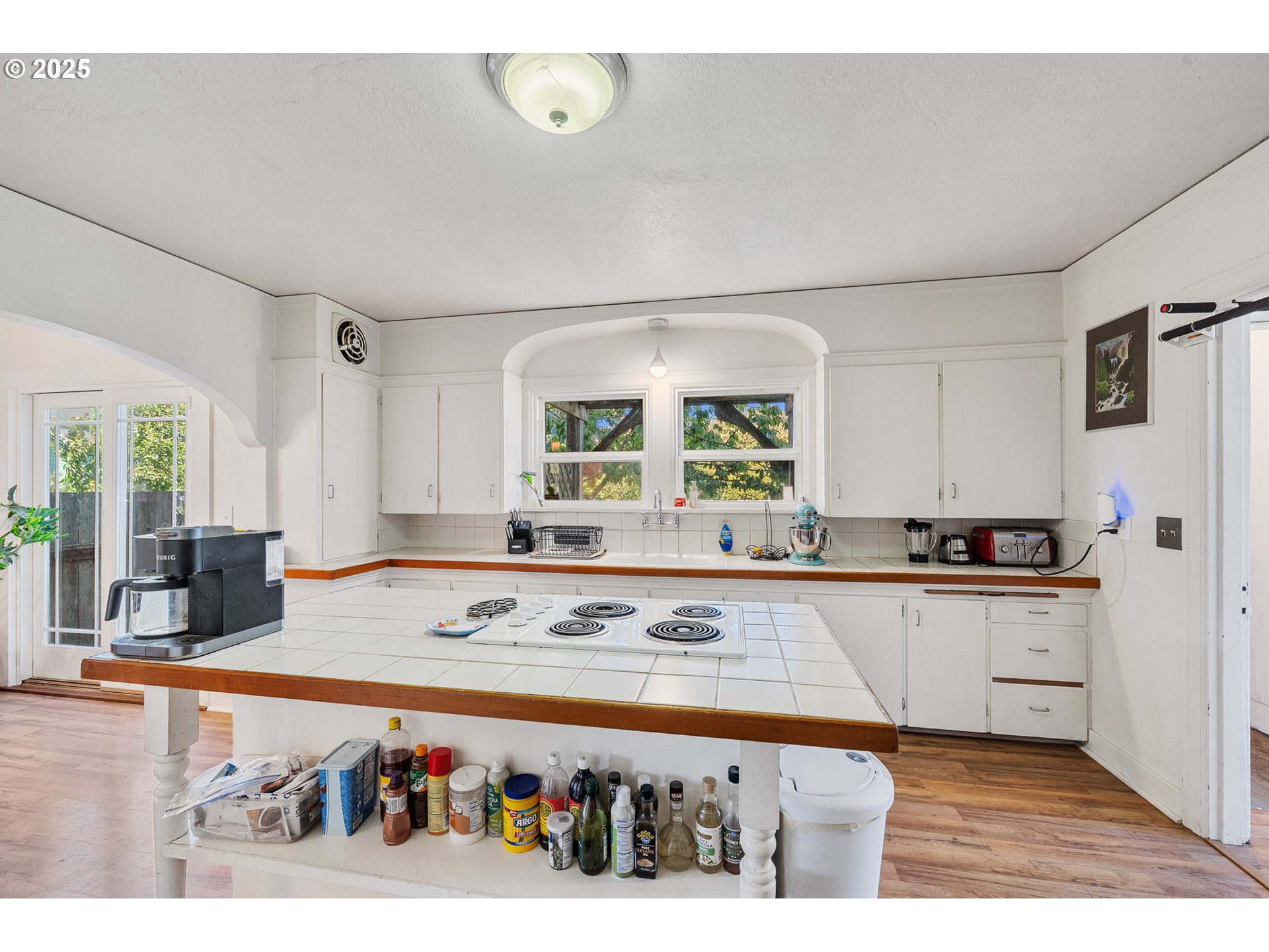 1703 4th Street Tillamook, OR 97141 - Photo 13 of 36 a kitchen with stainless steel appliances granite countertop a sink and cabinets