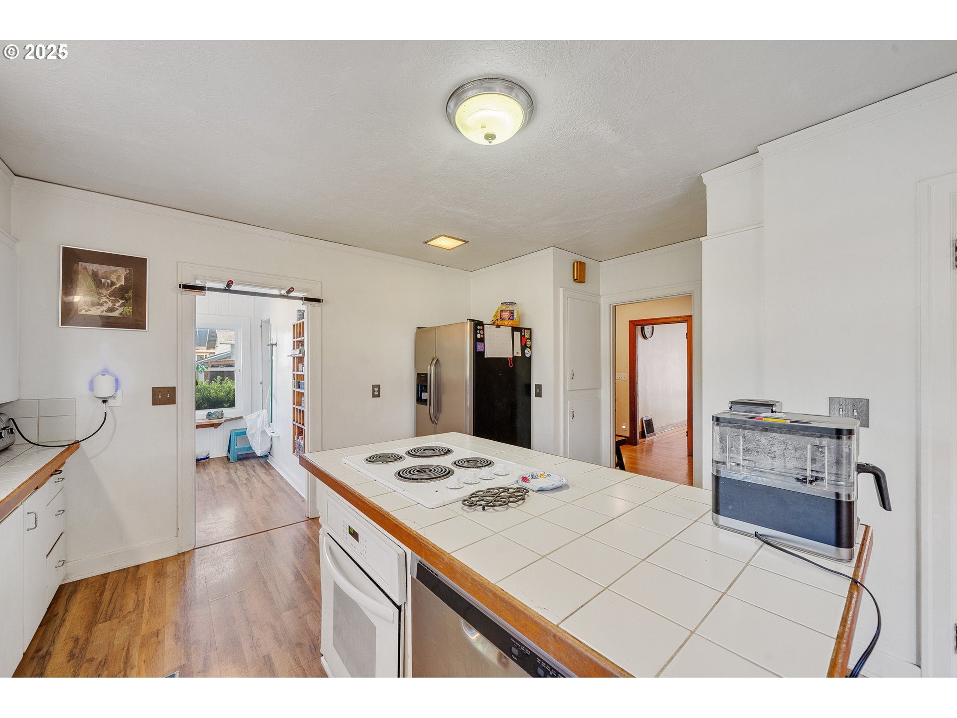 1703 4th Street Tillamook, OR 97141 - Photo 14 of 36 a living room with stainless steel appliances kitchen island granite countertop furniture and a view of living room