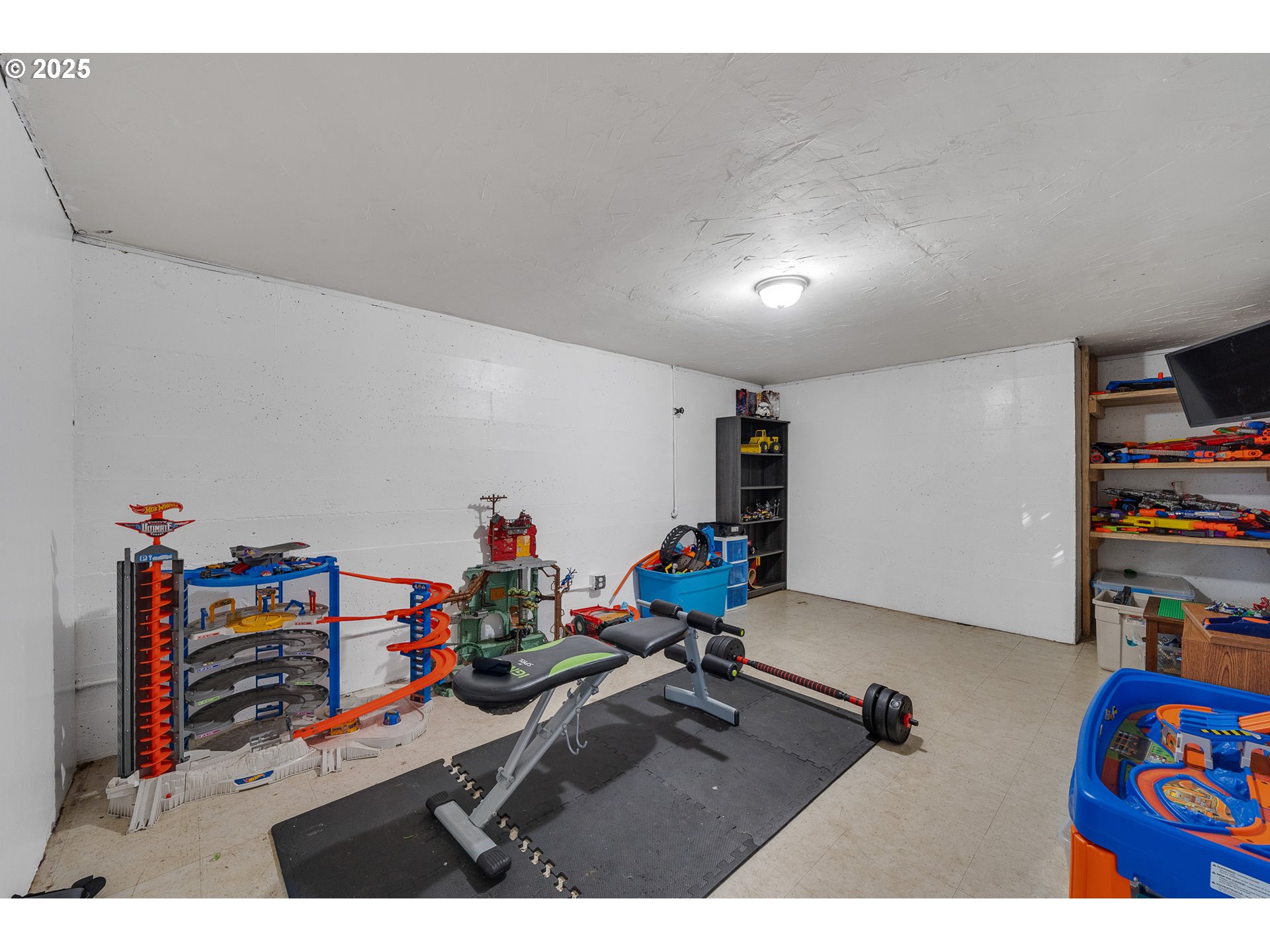 1703 4th Street Tillamook, OR 97141 - Photo 17 of 36 a room with furniture and a wooden floor