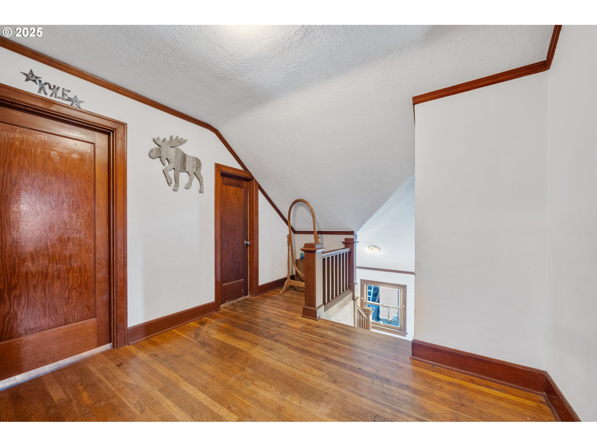 1703 4th Street Tillamook, OR 97141 - Photo 22 of 36 a view of empty room with wooden floor