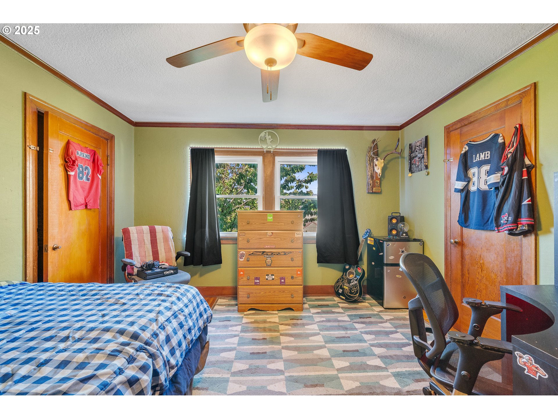 1703 4th Street Tillamook, OR 97141 - Photo 24 of 36 a bedroom with a bed and wooden floor