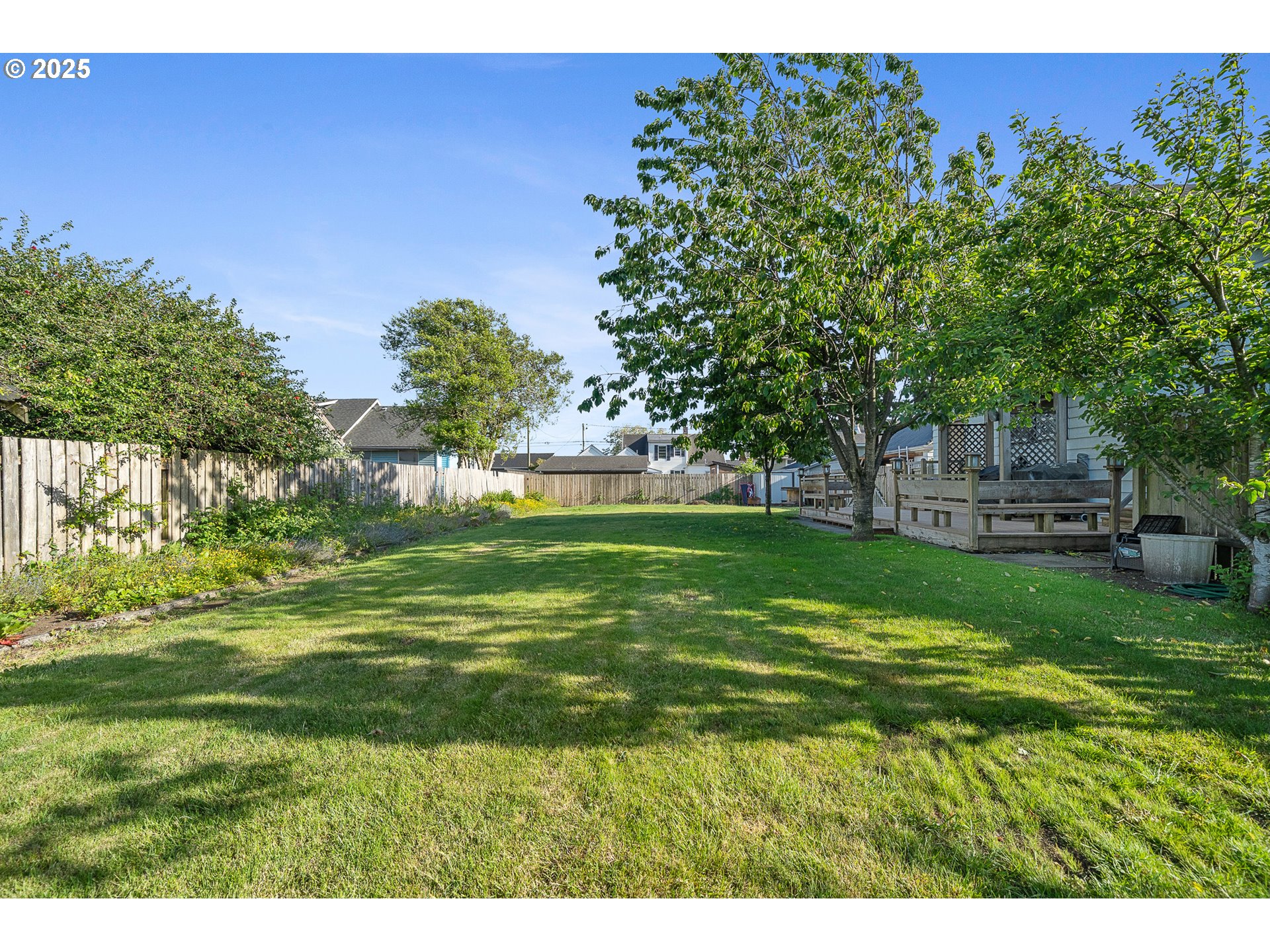 1703 4th Street Tillamook, OR 97141 - Photo 34 of 36 a backyard of a house with lots of green space