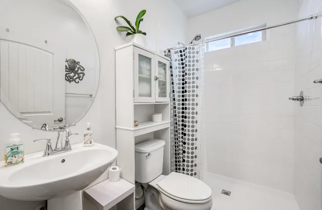 a spacious bathroom with a double vanity sink and a mirror