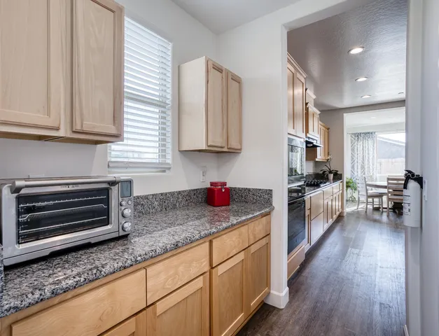 a kitchen with stainless steel appliances granite countertop a granite counter tops and a counter space