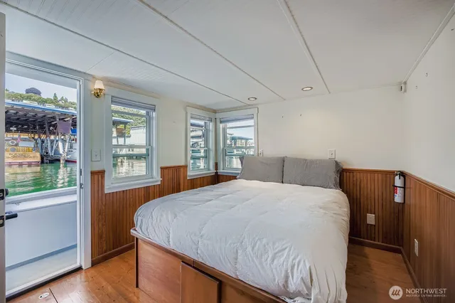 a bedroom with a large bed and a window