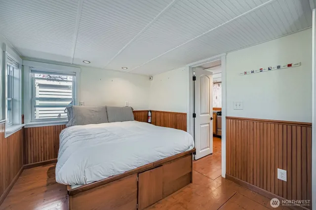 a bed room with a bed and a dresser