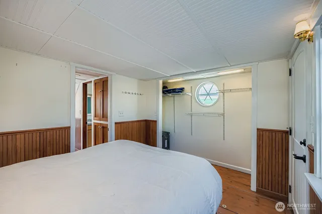 a bedroom with a bed and a closet