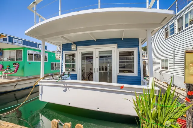 a swimming pool with outdoor seating and yard