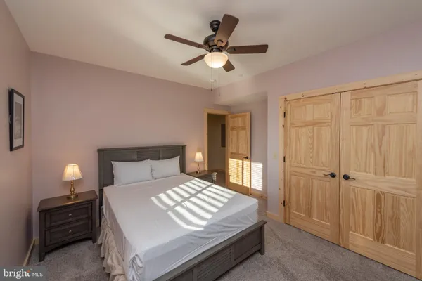 a bedroom with a bed and a dresser