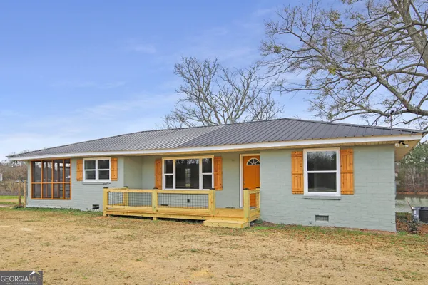 a house with trees in front of it