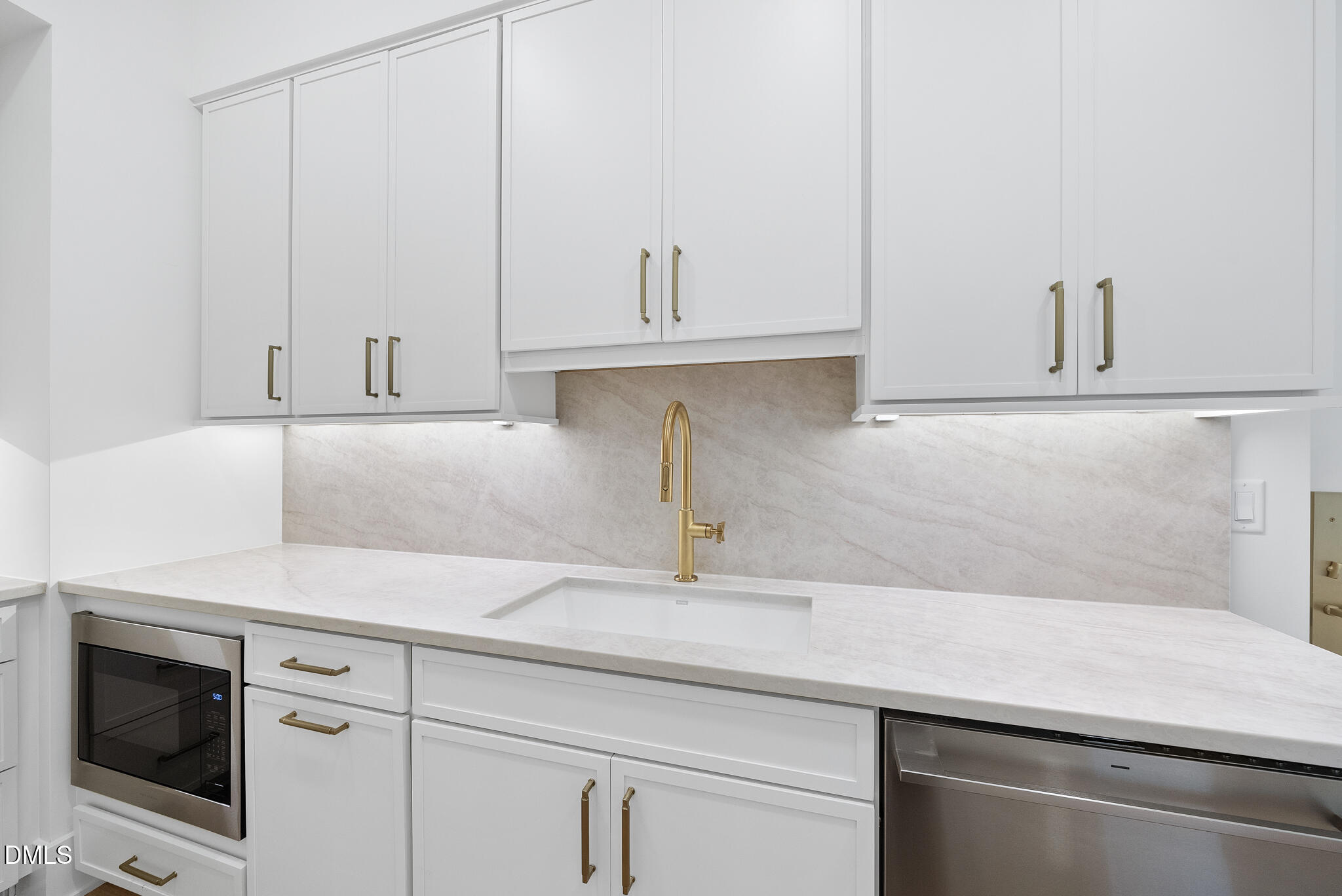 7608 Falls Creek Lane Raleigh, NC 27614 - Photo 22 of 74 a kitchen with cabinets stainless steel appliances and a sink