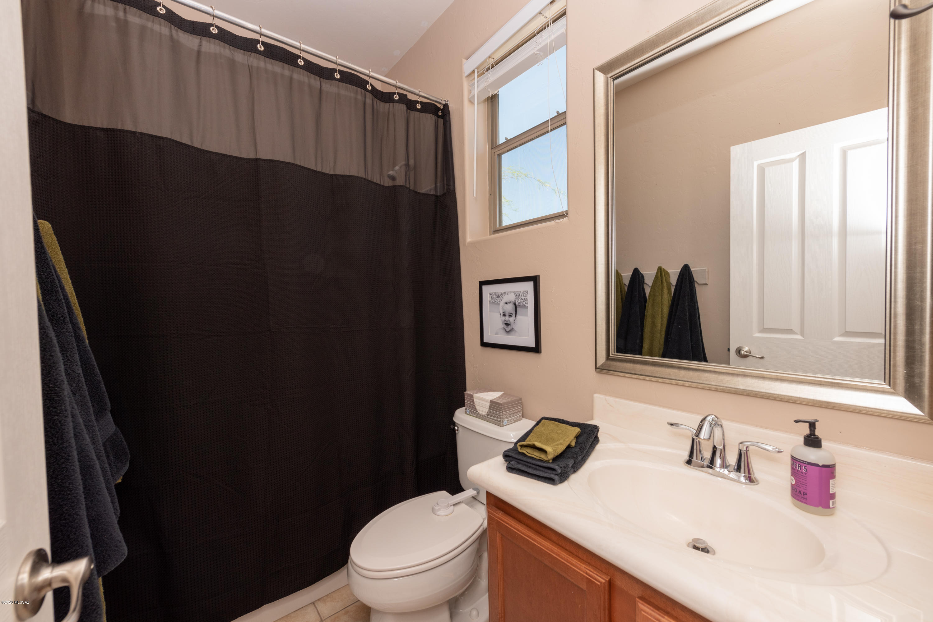 12910 Bloomington Loop Oro Valley, AZ 85755 - Photo 28 of 30 a bathroom with a sink and toilet