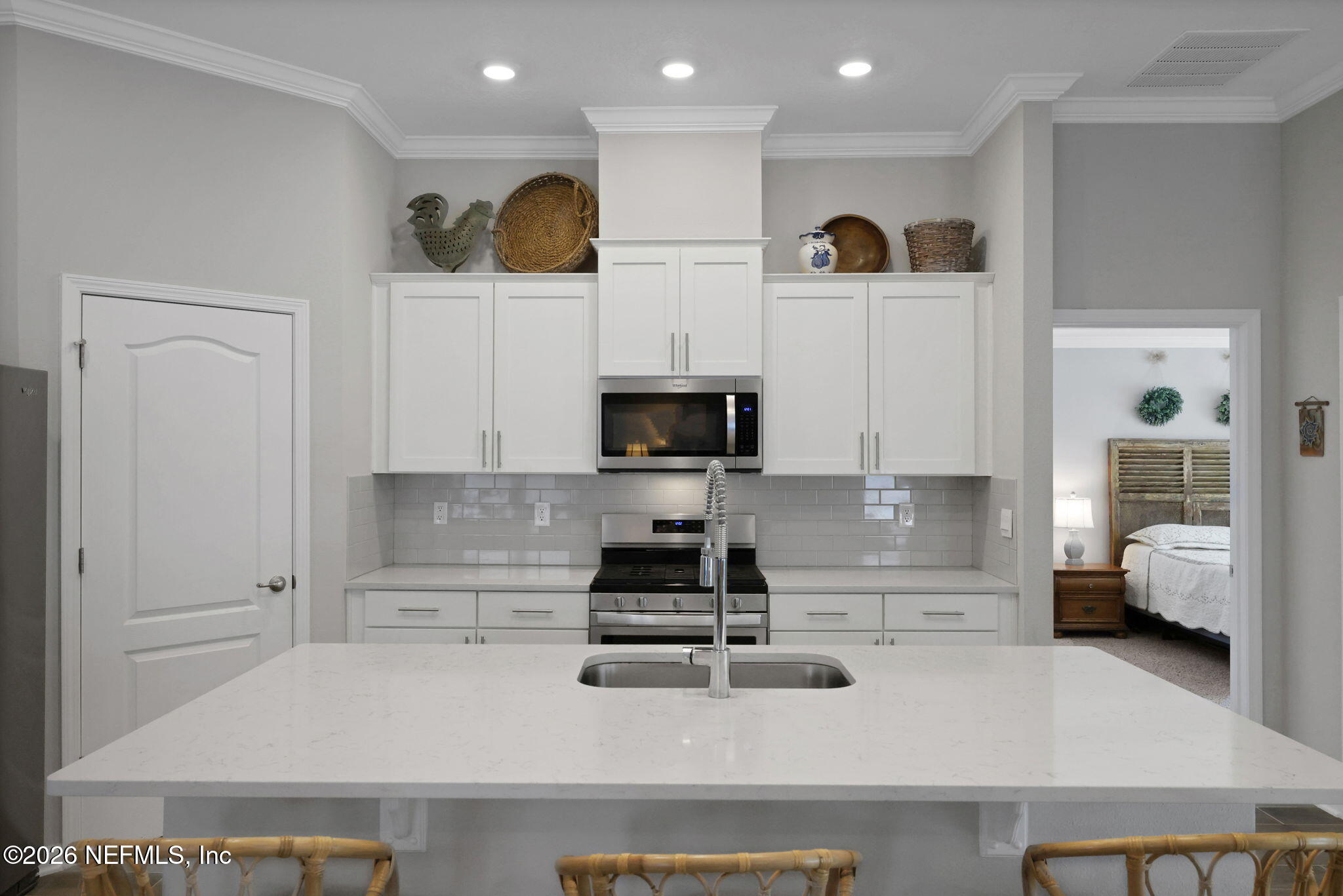 84 Cardinal Branch Lane St. Augustine, FL 32095 - Photo 14 of 45 a kitchen with white cabinets and refrigerator