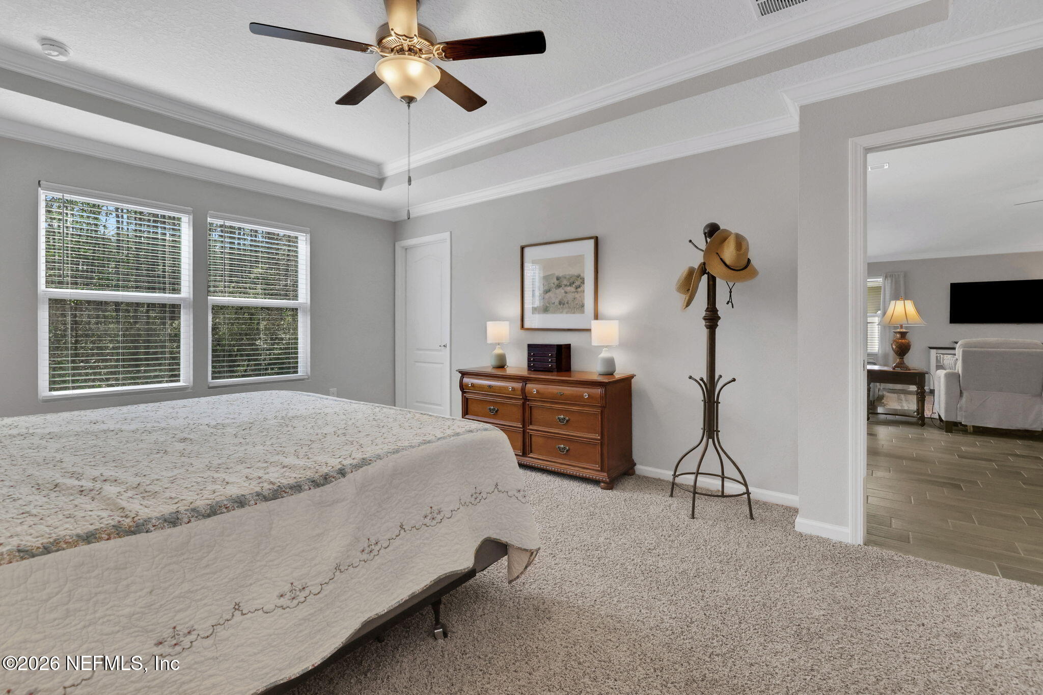 84 Cardinal Branch Lane St. Augustine, FL 32095 - Photo 24 of 45 a bedroom with a bed and a chandelier