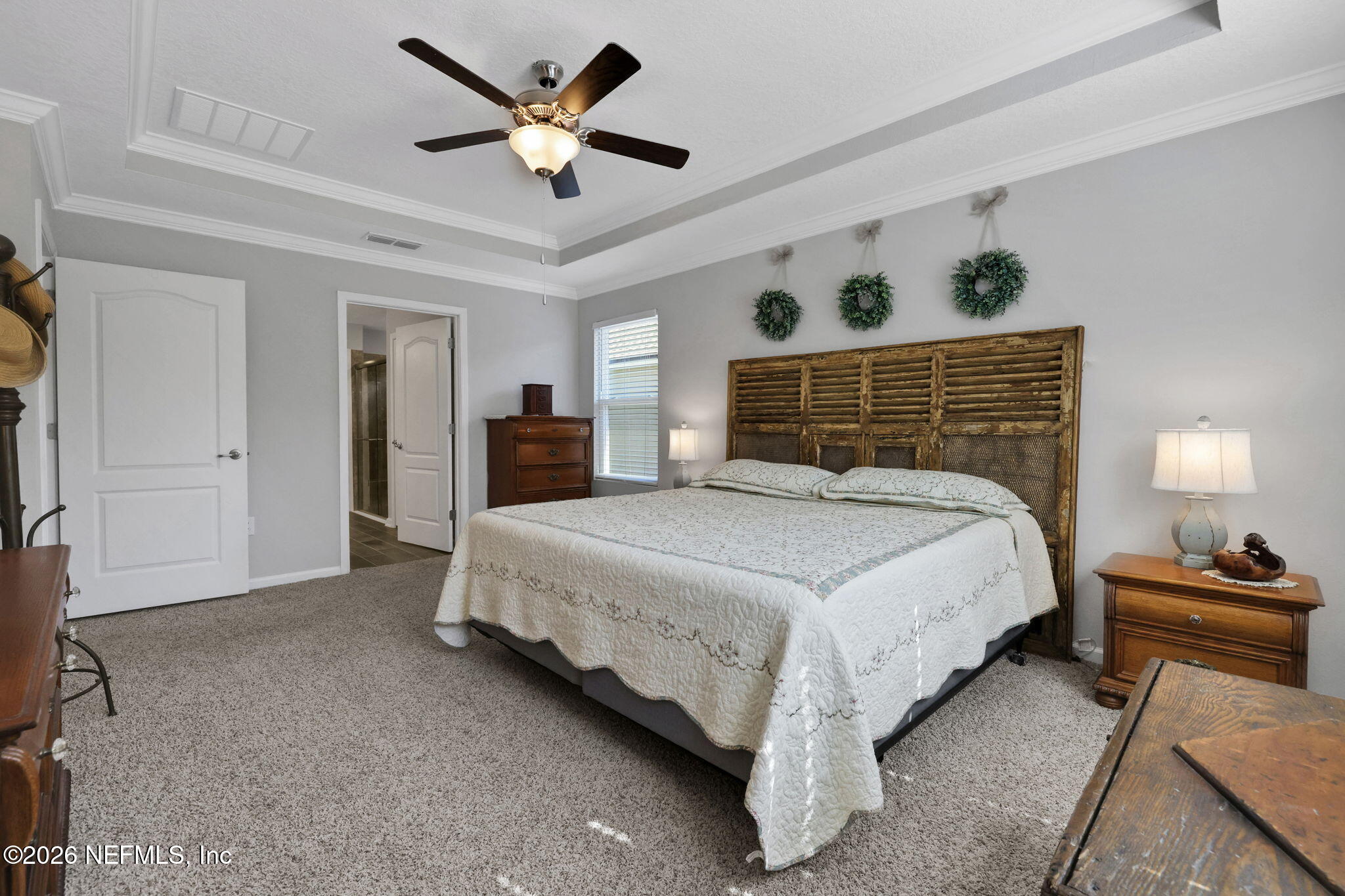 84 Cardinal Branch Lane St. Augustine, FL 32095 - Photo 25 of 45 a bedroom with a bed and a ceiling fan