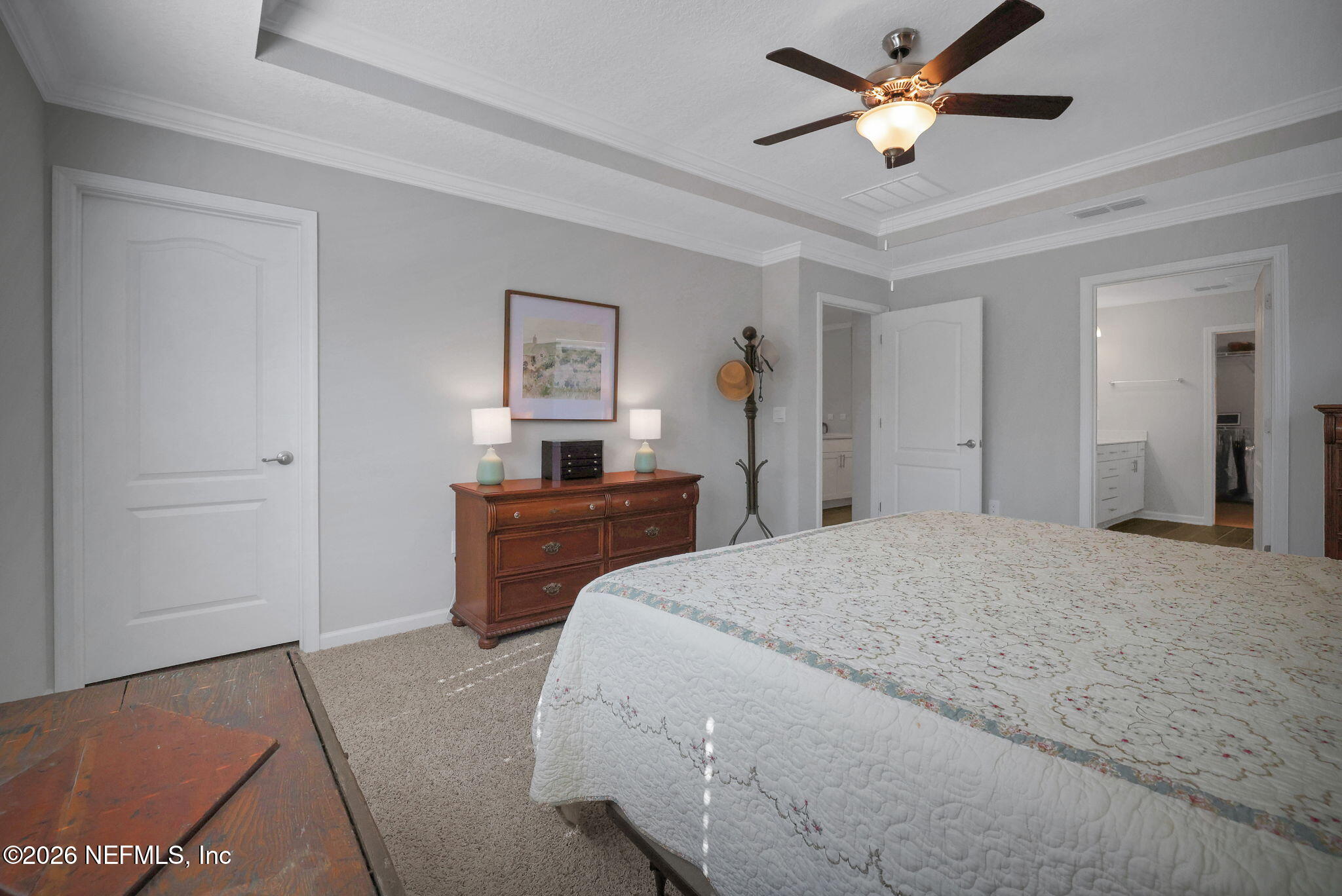 84 Cardinal Branch Lane St. Augustine, FL 32095 - Photo 27 of 45 a bedroom with a bed and a chandelier