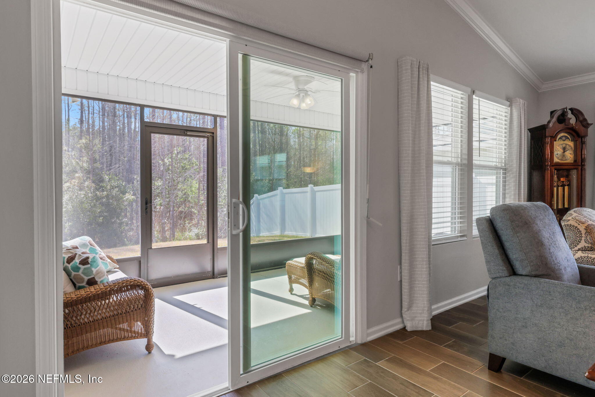 84 Cardinal Branch Lane St. Augustine, FL 32095 - Photo 37 of 45 a living room with furniture and a floor to ceiling window