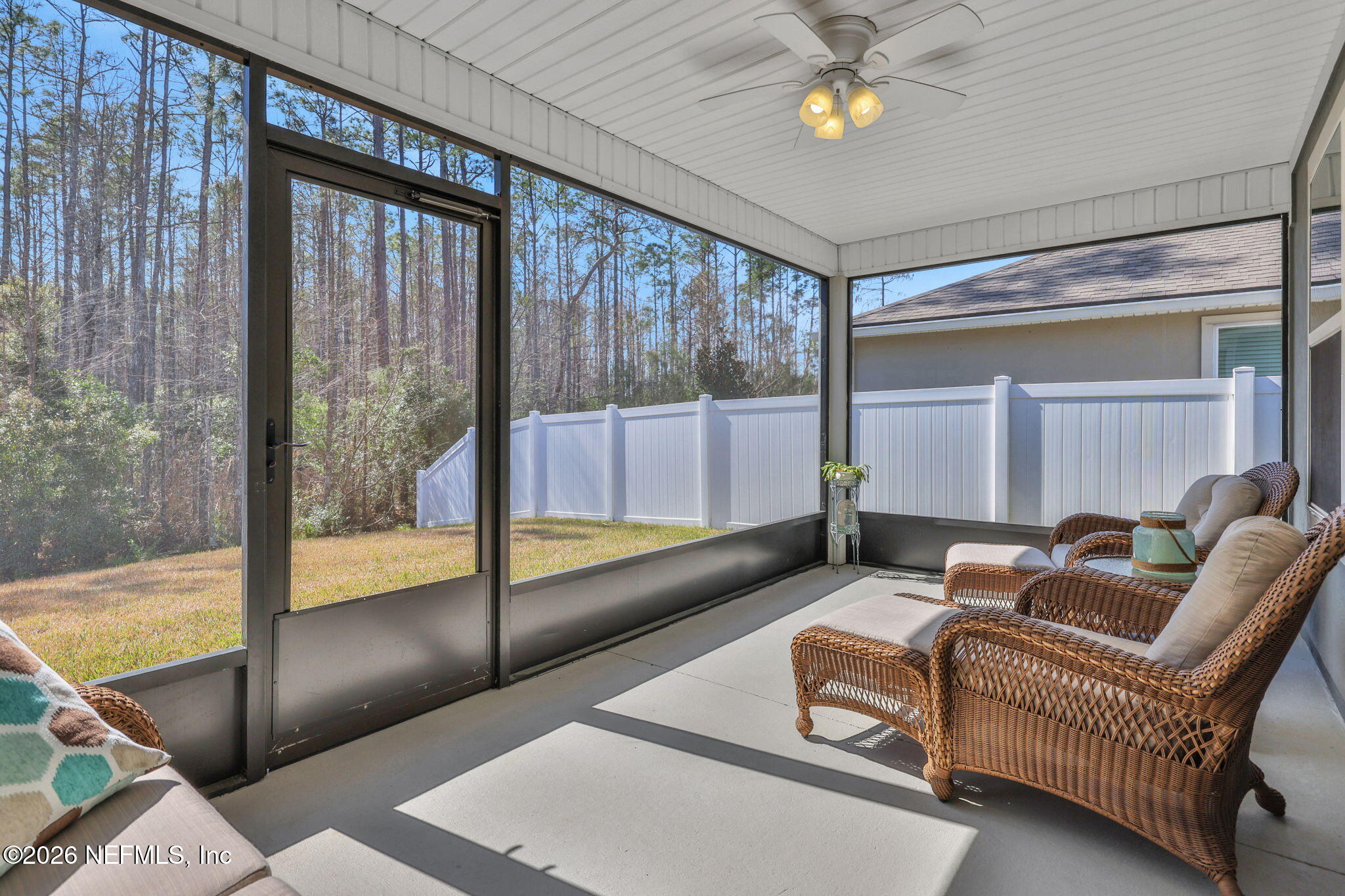 84 Cardinal Branch Lane St. Augustine, FL 32095 - Photo 38 of 45 a living room with furniture and a floor to ceiling window