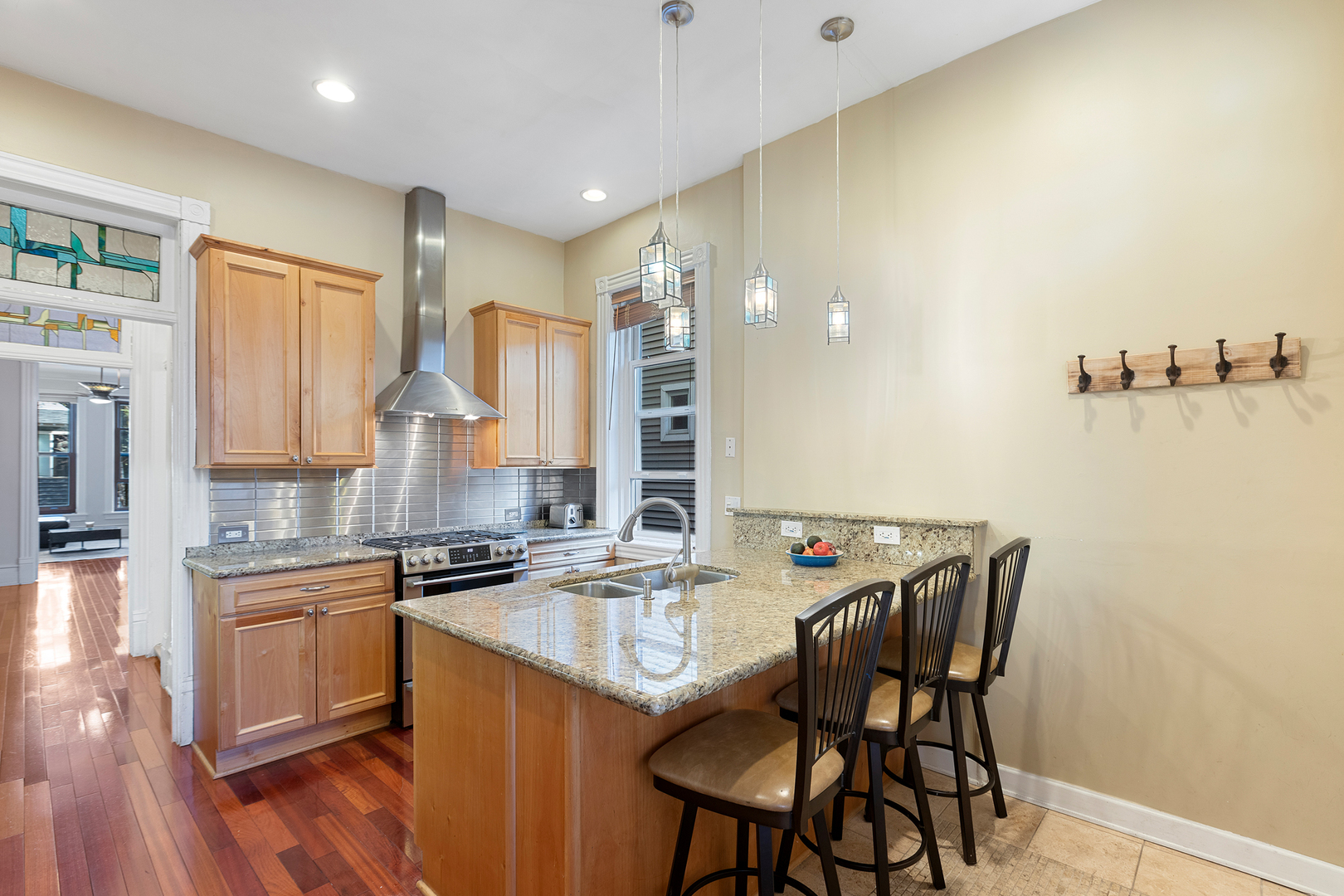 929 West Fletcher Street Chicago, IL 60657 - Photo 12 of 53 a kitchen with a table chairs stove and cabinets
