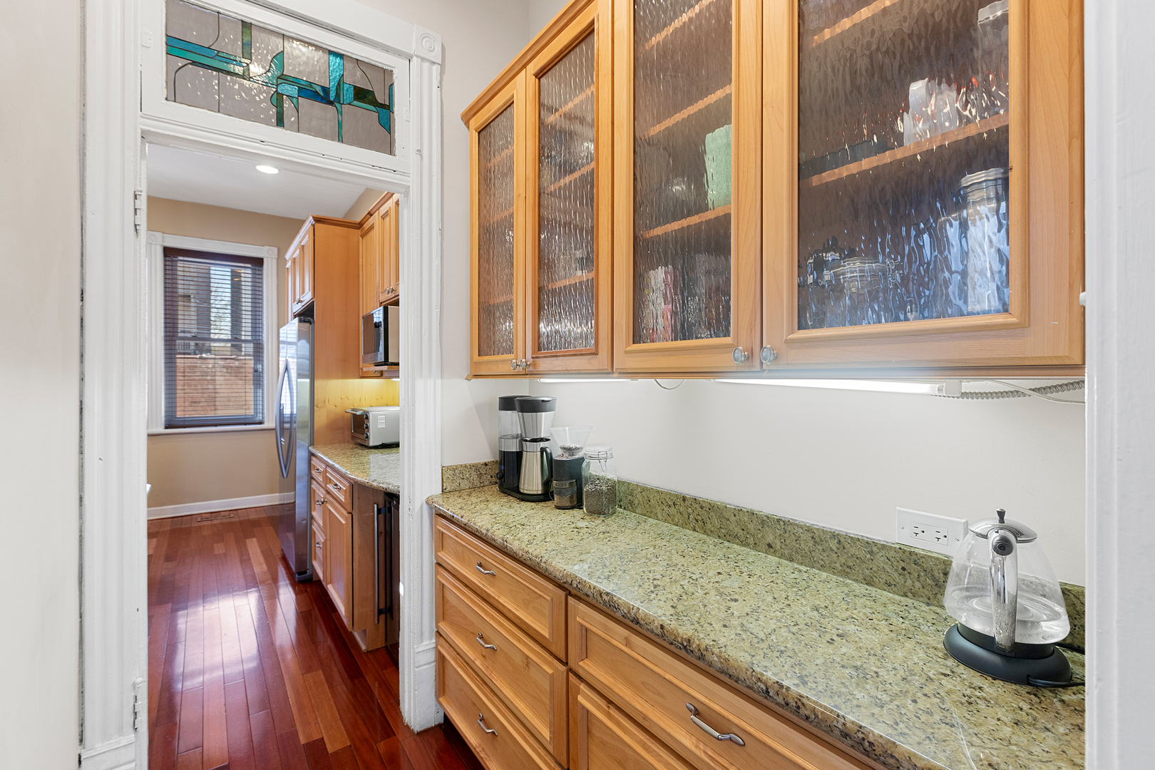 929 West Fletcher Street Chicago, IL 60657 - Photo 15 of 53 a kitchen with a sink and wooden floor
