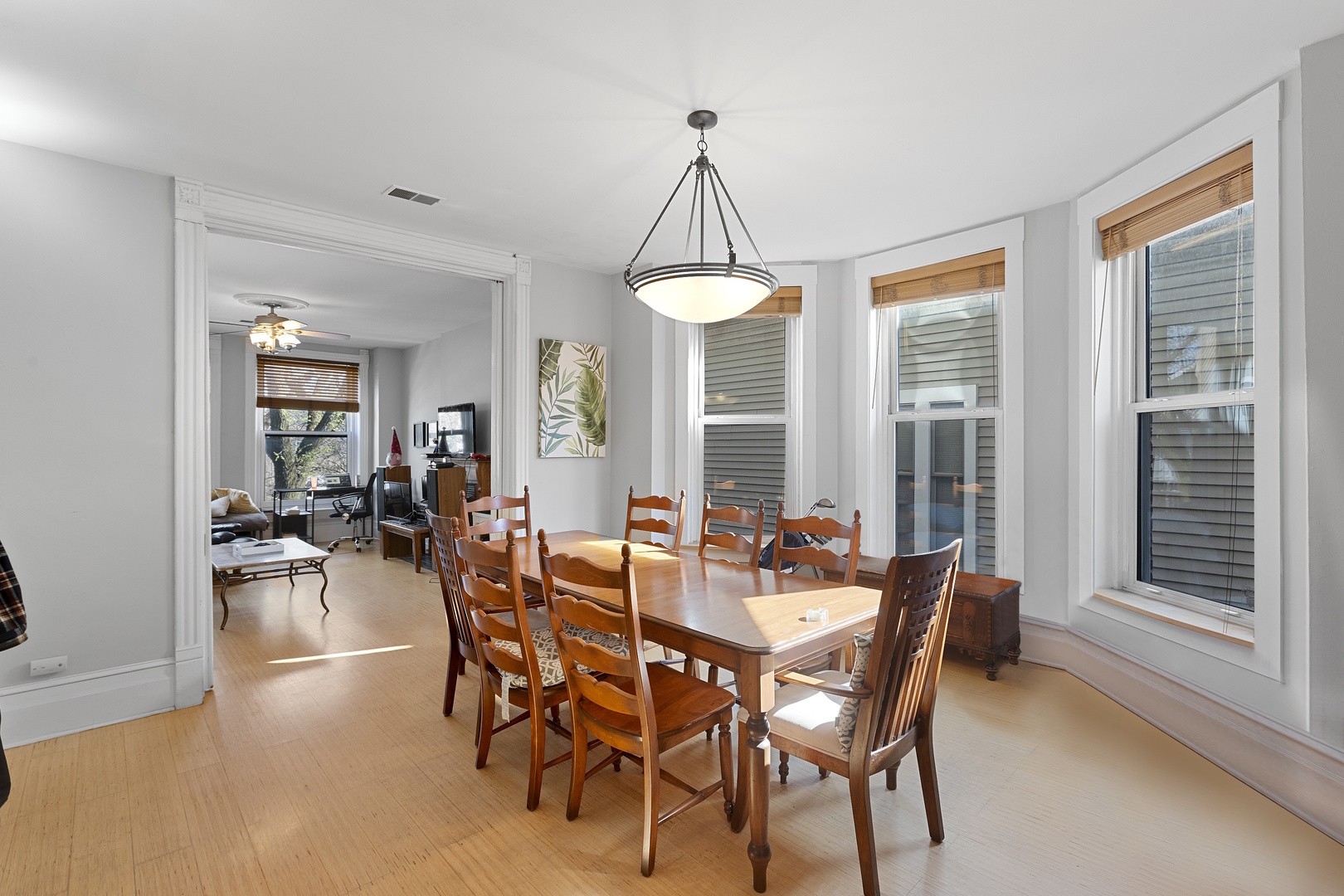 929 West Fletcher Street Chicago, IL 60657 - Photo 30 of 53 a dining room with furniture a chandelier and wooden floor