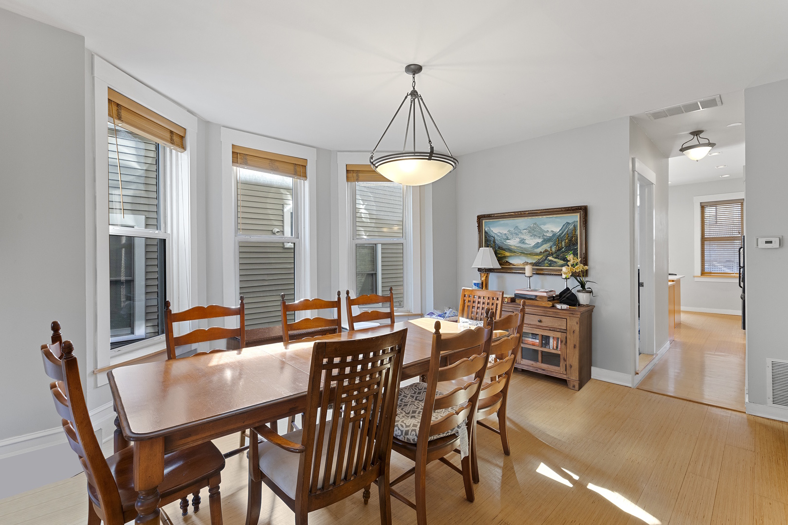 929 West Fletcher Street Chicago, IL 60657 - Photo 33 of 53 a dining room with furniture a chandelier and wooden floor