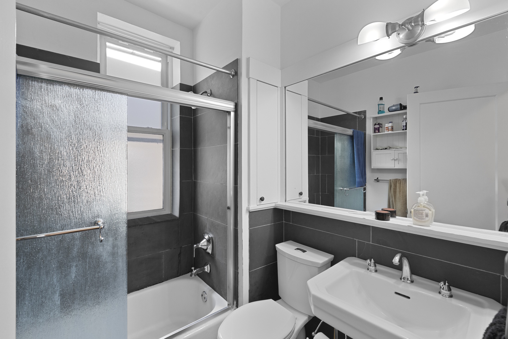 929 West Fletcher Street Chicago, IL 60657 - Photo 37 of 53 a bathroom with a sink toilet and shower