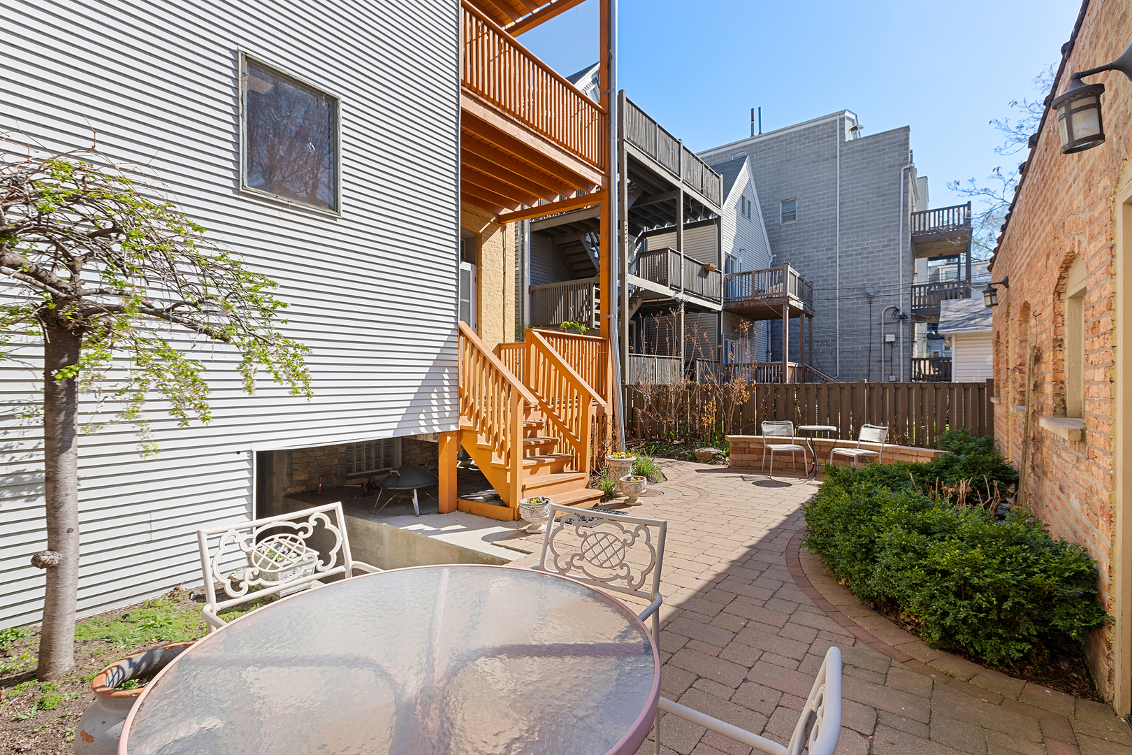 929 West Fletcher Street Chicago, IL 60657 - Photo 4 of 53 a view of a house with backyard and sitting area